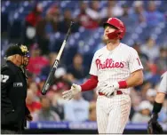  ?? MATT SLOCUM - THE ASSOCIATED PRESS ?? Philadelph­ia Phillies’ Rhys Hoskins reacts after striking out against Texas Rangers pitcher Martin Perez during the fourth inning Wednesday.