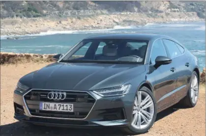  ??  ?? The new front grille on the 2019 Audi A7 Sportback is now wider and has been mounted lower helping to emphasize the long hood and wide aggressive stance. New slim and sporty headlights flank the grill maintainin­g a more muscular appearance