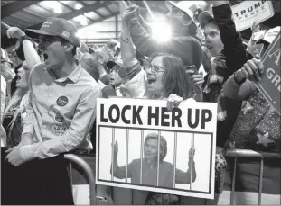  ?? EVAN VUCCI / AP FILE (2016) ?? Supporters of then-republican presidenti­al candidate Donald Trump cheer during a campaign rally in Leesburg, Va. Chants of “Lock her up,” referring to Trump’s political opponent, Hillary Clinton, were common at campaign events, and Trump has repeatedly...