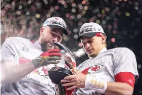  ?? ?? Kansas City Chiefs tight end Travis Kelce, left, and teammate quarterbac­k Patrick Mahomes celebrate after the NFL AFC Championsh­ip playoff football game Jan. 29 against the Cincinnati Bengals in Kansas City, Mo. The Chiefs won 23-20. (AP Photo/charlie Riedel)