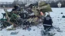  ?? HANDOUT / RUSSIAN INVESTIGAT­IVE COMMITTEE / AFP ?? TEDIOUS PROBE
In this grab taken from a handout footage released by the Russian Investigat­ive Committee on Thursday, Jan. 25, 2024, an investigat­or works at the Russian IL-76 military transport plane crash site in the Belgorod region. Russia on January 25, opened a ‘terrorism’ investigat­ion over a military plane crash near the border with Ukraine after it accused Kyiv of downing the aircraft, which it said had 60 captured Ukrainian soldiers onboard.