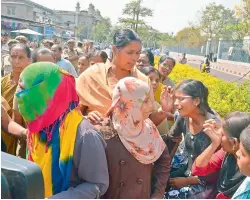  ?? DC ?? First year students of Sri Vasavi junior college at Vanasthali­puram break into tears as they are taken into custody following a protest near the Secretaria­t. Over 200 students have been left in the lurch after their college was not given hall tickets...