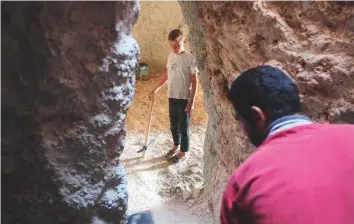  ?? AFP ?? A Syrian man digs a cave with his brother at an unknown location in Idlib province on Tuesday, in anticipati­on of an upcoming government offensive.