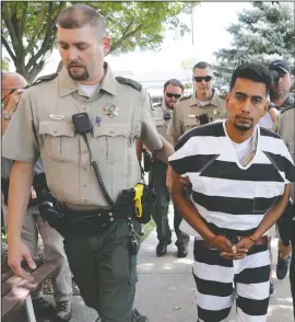  ?? AP/CHARLIE NEIBERGALL ?? Cristhian Bahena Rivera is escorted into the Poweshiek County Courthouse for his initial court appearance Wednesday in Montezuma, Iowa. Rivera is charged with first-degree murder in the death of Mollie Tibbetts, who disappeare­d July 18 from Brooklyn, Iowa.