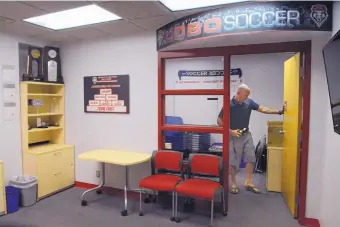  ?? JIM THOMPSON/JOURNAL ?? UNM men’s soccer coach Jeremy Fishbein, shown cleaning out his office, will have his contract expire today as the program will be officially cut Monday.