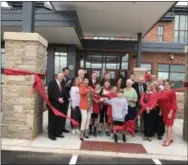  ?? LAURA CATALANO — FOR DIGITAL FIRST MEDIA ?? The ribbon officially cut, applause breaks out as students and teachers prepare to enter the new East Coventry Elementary School for the first time on Friday.