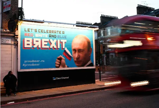  ??  ?? A RETREAT INTO ECONOMIC NATIONALIS­M: A Brexit-themed billboard depicting Russian President Vladimir Putin that reads ‘Let’s celebrate a red, white and blue Brexit’ in north London. Photo: Daniel Sorabji/Getty