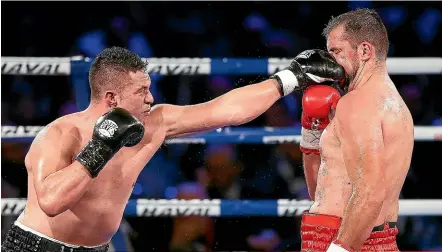  ?? GETTY IMAGES ?? Kiwi heavyweigh­t Joseph Parker lands a left to the face of Razvan Cojanu (Romania) in a fight last year.