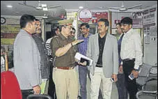  ??  ?? (From left) Police officials at UBI’S Pashupati Nagar branch; The robbers emptied 26 lockers.