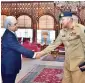  ?? APP ?? Army Chief Gen. Qamar Javed Bajwa shakes hands with caretaker Premier Nasirul Mulk at the PM Office in Islamabad. —