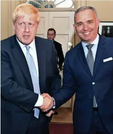  ?? Picture: REUTERS ?? GOLDEN HANDSHAKE: Boris Johnson and Sir Mark Sedwill