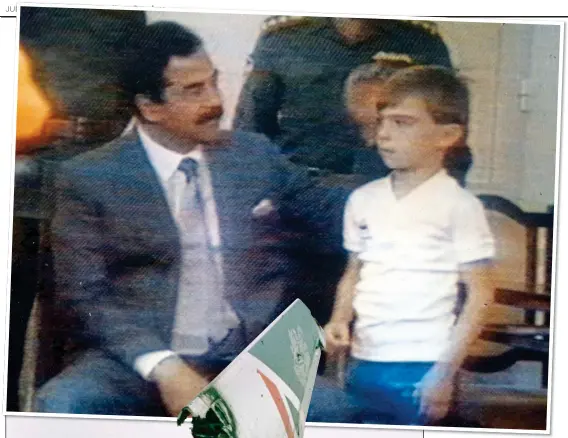  ??  ?? PROPAGANDA: Saddam with young Stuart Lockwood. Left: The wreckage of Flight 149 in Kuwait
