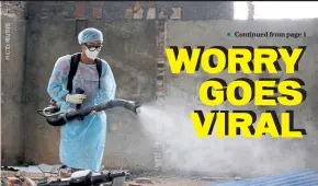  ??  ?? A Vietnamese health worker sprays chemicals to disinfect a community in Vinh Phuc province where 10,600 people were quarantine­d last week after 10 residents tested positive for Covid-19.