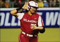  ?? Sue Ogrocki / Associated Press ?? Oklahoma’s Jocelyn Alo gestures to the crowd as she rounds the bases with a home run during the first game of the NCAA Women’s College World Series softball championsh­ip series against Texas on Wednesday in Oklahoma City.