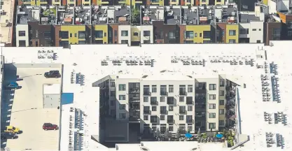  ?? RJ Sangosti, The Denver Post ?? As Denver’s population surges, and developers race to meet demand, a lack of green space in the city is rankling residents. In this photo, apartment buildings north of downtown Denver are seen from the air on Sept. 25. Aerial support for photos was provided by Lighthawk.