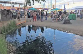  ?? DAVE CATHEY ?? The cannabis community gathers June 3 for a GreenGrow kickoff party at Relax Park in downtown Oklahoma City.