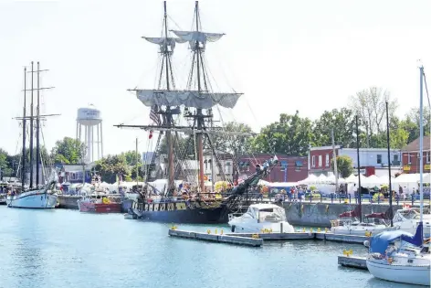  ?? TRIBUNE FILE PHOTO ?? Empire Sandy, at the left, and the U.S. brig Niagara, with its sails shown, will again dock along Port Colborne's West Street this weekend for the Canal Days Marine Heritage Festival.