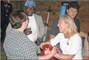  ?? Doug Walker ?? Layla Shipman and Jamie Palmer speak with Marjorie Taylor Greene (right) at the Rome City Brewing Company during the Floyd County GOP’S watch party as election results came in on Tuesday night.