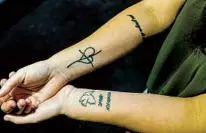  ?? ?? Starting clockwise from top left is a tattoo that the author thinks means “hope, faith and love,” one the author says is “by the grace of God” written in Italian and a third showing Roman numbers with her siblings’ birthdays and a dove of peace.