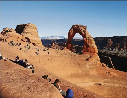  ??  ?? Delicate Arch in Arches National Park is a popular place to watch the sun go down.