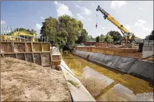  ?? TY GREENLEES / STAFF ?? The deteriorat­ing Woodman Drive bridge in Kettering, built in 1975 and which spans Little Beaver Creek, is being reconstruc­ted. The structure’s box beams are in need of replacemen­t.