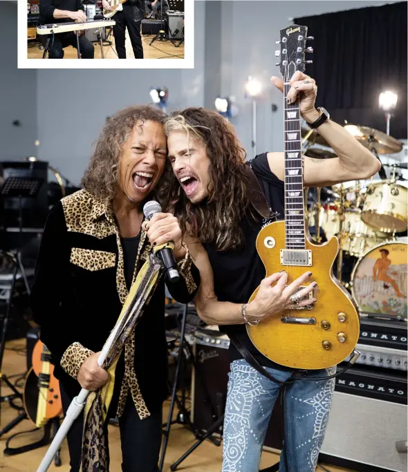  ??  ?? BELOW: “Steven Tyler didn’t know that Kirk owned Peter’s guitar, and he was shocked when he found out. So Kirk grabbed Steven’s microphone and they threw some shapes. When that photo went on social media the entire world thought they were forming some kind of supergroup, but it was just messing around.”