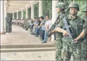  ?? REUTERS FILE ?? Chinese paramilita­ry personnel stand guard at an event to award those who participat­ed in a “crackdown on terrorists”.