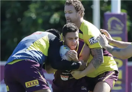  ?? Picture: AAP IMAGE ?? Kodi Nikorima is the centre of attention at Broncos training yesterday.