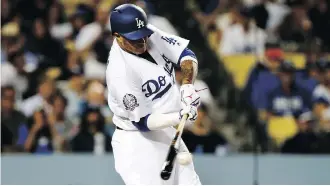  ?? ALEX GALLARDO/THE ASSOCIATED PRESS ?? The acquisitio­n of Manny Machado at the all-star break and the return to health of a problemati­c bullpen have helped the Los Angeles Dodgers turn what had been a losing season into a September rush that has them in position to win their sixth-straight NL West title.