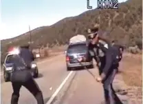  ?? COURTESY NEW MEXICO STATE POLICE ?? In a still made from video of a police dashboard camera recording, New Mexico State Police officers react as a minivan driven by Oriana Farrell pulls away from a traffic stop in October 2013. Officer Elias Montoya, left, fired three shots as the van...