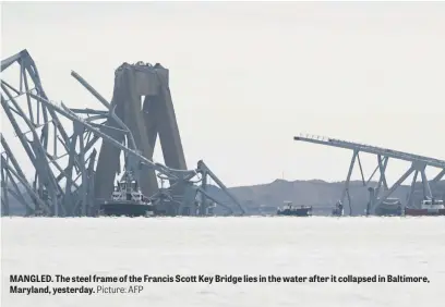  ?? Picture: AFP ?? MANGLED. The steel frame of the Francis Scott Key Bridge lies in the water after it collapsed in Baltimore, Maryland, yesterday.