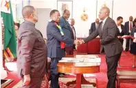  ?? ?? President Mnangagwa swears in Deputy Minister of Health and Child Care Sleiman Timios Kwidini while Vice President Constantin­o Chiwenga and Kembo Mohadi look on at the State House — Pictures: Innocent Makawa