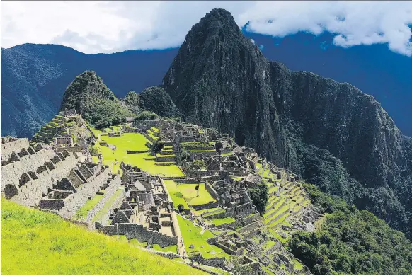  ?? PHOTOS: SHARON LINDORES ?? Peru’s famed Machu Picchu rises about 2,400 metres above sea level in the Andes Mountains. Locals recommend cocoa tea to help with altitude sickness.