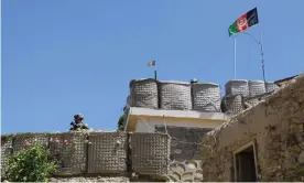  ?? Photograph: Handout/Reuters ?? A US adviser stands at the fortificat­ion of a base during deployment to Afghanista­n in
June 2019. The collapse of protracted US-Taliban negotiatio­ns has triggered fears of a spike in
violence.