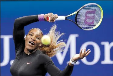  ?? AP/SETH WENIG ?? Serena Williams returns a shot to Qiang Wang on Tuesday during the quarterfin­als of the U.S. Open tennis tournament in New York.
