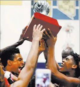  ?? Elizabeth Brumley ?? Las Vegas Review-journal California Supreme Elite players hold their championsh­ip trophy after claiming the Las Vegas Classic platinum elite title Sunday at Spring Valley High School.