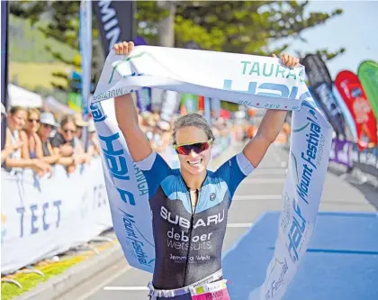  ?? Photo / Supplied ?? Tauranga’s Hannah Wells claims victory in the Tauranga Half at the Mount Festival of Multisport last year.