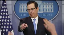  ??  ?? In this Feb. 23, file photo, Treasury Secretary Steve Mnuchin gestures as he answers questions during a briefing at the White House in Washington. It looks like President Donald Trump’s romance with the Goldman Sachs crowd is going cold. Top economic...