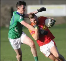  ??  ?? P.J. Banville tries to shake off Shane Kenny of Rathcline.