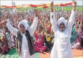  ?? MANOJ DHAKA/HT ?? Protesters raising slogans at the ongoing dharna in Jassia village, and (right) Rahul Dadu sitting on a hunger strike (centre) in Rohtak. He was booked by police on Thursday for promoting enmity and public mischief.