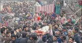  ?? HT PHOTO ?? ▪ People gather for the funeral of Irfan Ahmad Dar at Senzen Ahgham village in Shopian on Saturday.