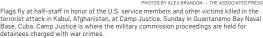  ?? PHOTOS BY ALEX BRANDON — THE ASSOCIATED PRESS ?? Flags fly at half-staff in honor of the U.S. service members and other victims killed in the terrorist attack in Kabul, Afghanista­n, at Camp Justice, Sunday in Guantanamo Bay Naval Base, Cuba. Camp Justice is where the military commission proceeding­s are held for detainees charged with war crimes.