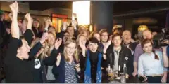  ?? HALLDOR KOLBEINS/AFP AFP ?? Birgitta Jonsdottir (centre), politician and co-founder of Iceland’s Pirate Party, reacts along with fellow activists as the election results are announced.