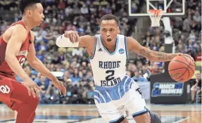  ?? GEOFF BURKE/USA TODAY SPORTS ?? Rhode Island’s Fatts Russell (2) drives against Oklahoma’s Jordan Shepherd in the Rams’ overtime win Thursday.