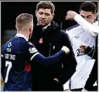  ??  ?? Having words: Gerrard speaks to Gardyne at full-time in Dingwall