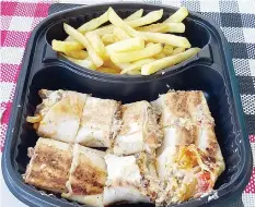  ??  ?? Chicken Shawarma with Regular Spice Fries