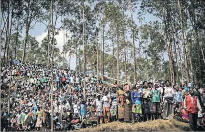  ??  ?? Mass action: Supporters attend a campaign rally for incumbent Rwandan President Paul Kagame this week in Gakenke ahead of the August 4 presidenti­al election. Photo: Marco Longari/AFP