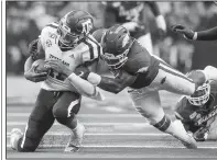  ?? NWA Democrat-Gazette/BEN GOFF • @NWABENGOFF ?? Arkansas linebacker De’Jon Harris tackles Texas A&M quarterbac­k Kellen Mond during the third quarter Saturday at AT&T Stadium in Arlington, Texas. Harris scored the first touchdown of his career during the game after recovering a fumble by Texas A&M running back Isaiah Spiller.