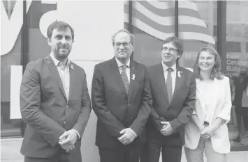  ?? AGENCE FRANCE PRESSE ?? Catalonia's ousted regional president Carles Puigdemont (2nd from right) flanked by his designated successor, Catalan regional president Quim Torra (2nd from left), poses in Brussels upon his arrival from Germany where he was detained at Madrid's...