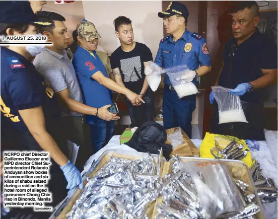  ?? EDD GUMBAN ?? NCRPO chief Director Guillermo Eleazar and MPD director Chief Superinten­dent Rolando Anduyan show boxes of ammunition and six kilos of shabu seized during a raid on the hotel room of alleged gunrunner Chong Chin Hao in Binondo, Manila yesterday morning.